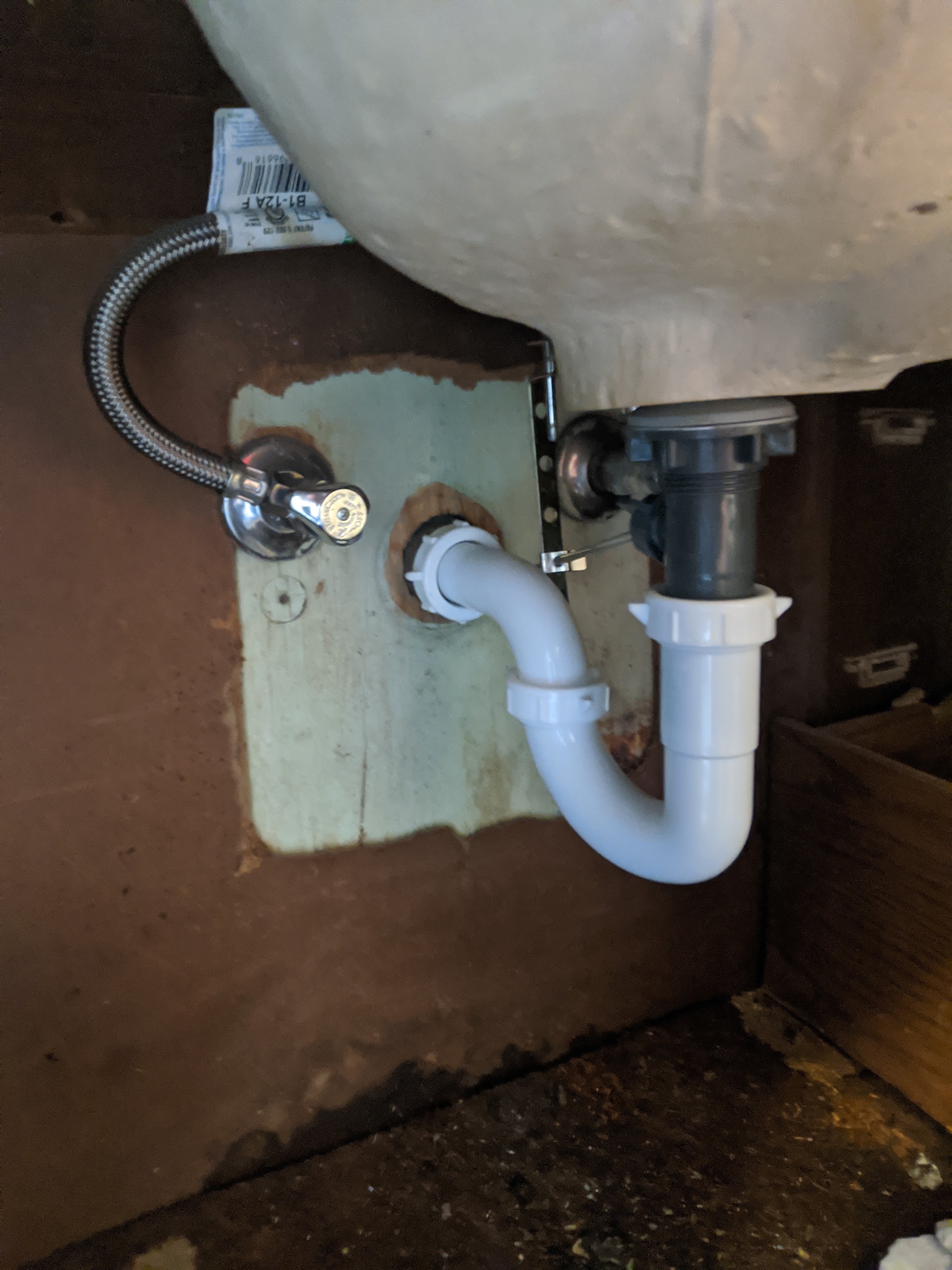 Under-sink drain and shutoff valve after our repair