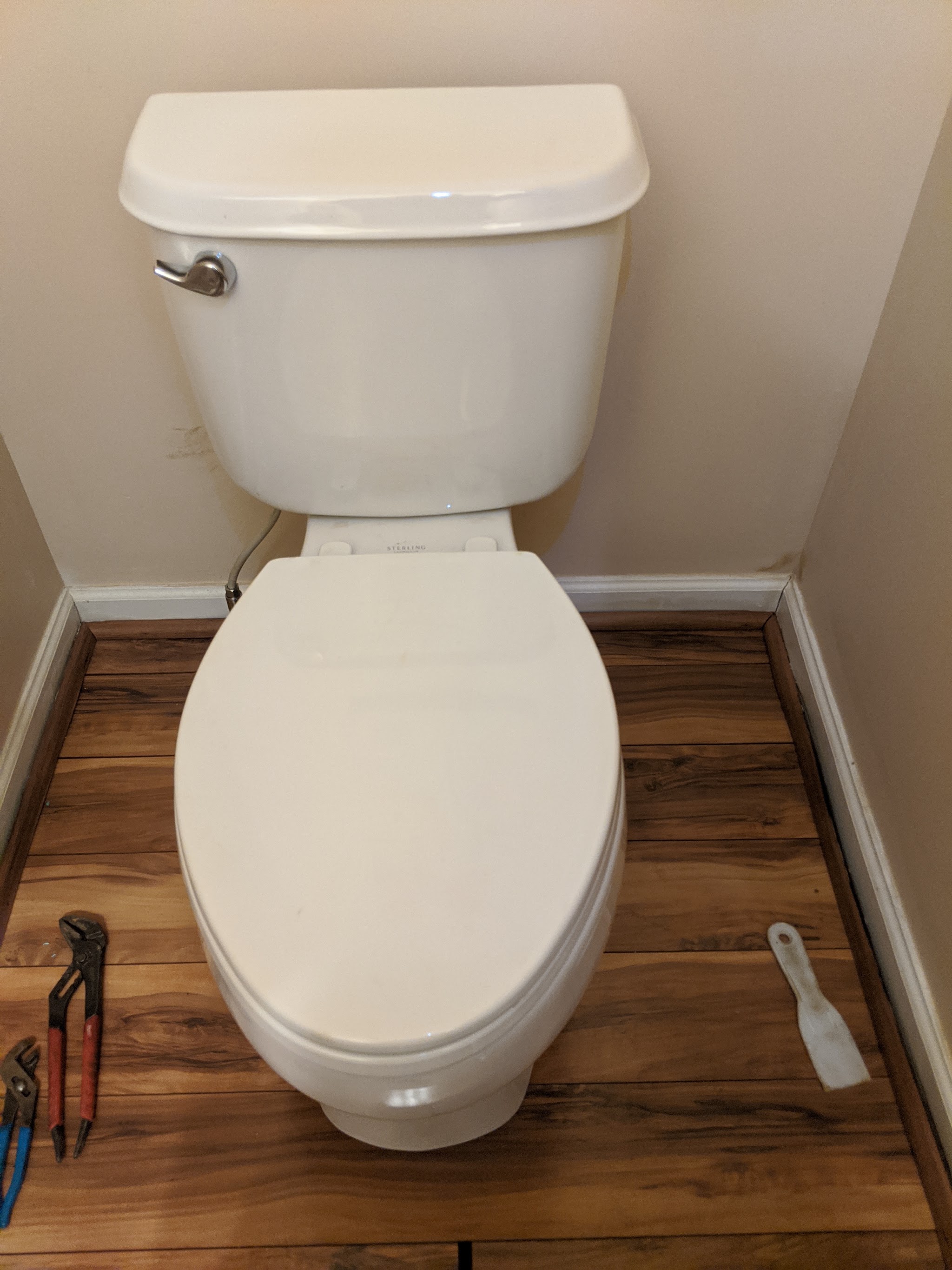 New toilet installed on a fresh floor