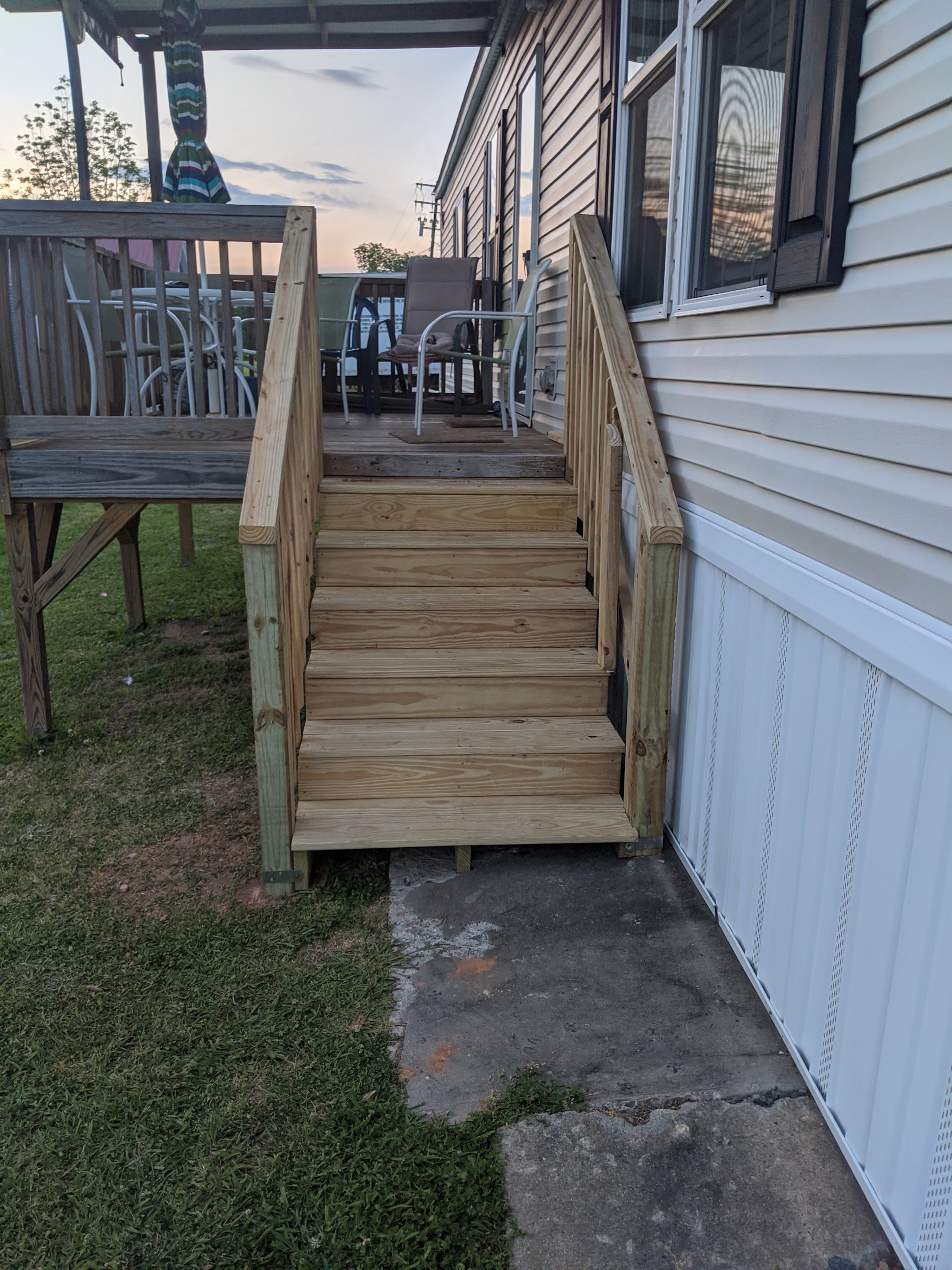 New pressure-treated wooden deck stairs