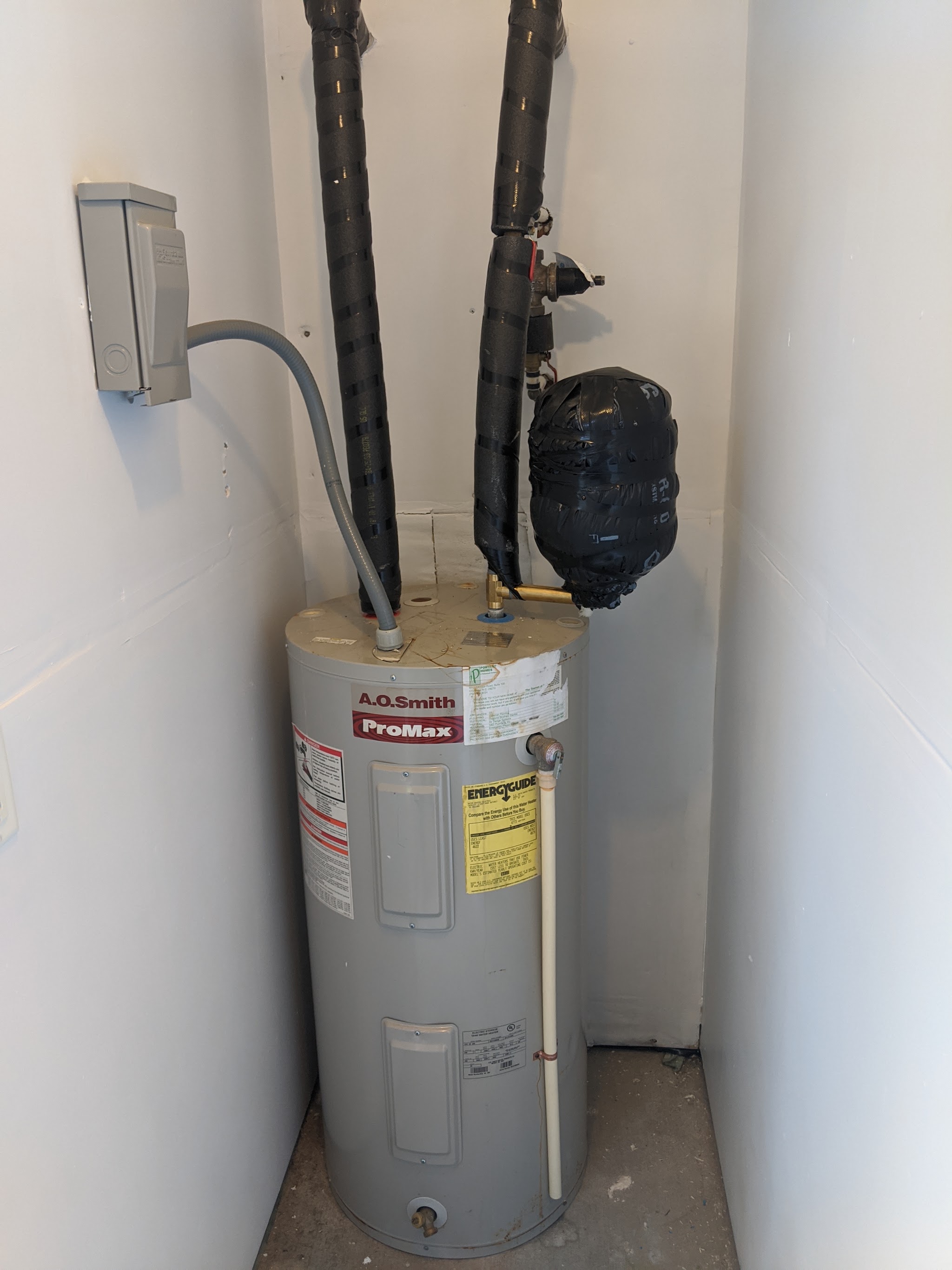Water heater we installed, with insulated lines and a clean electrical box