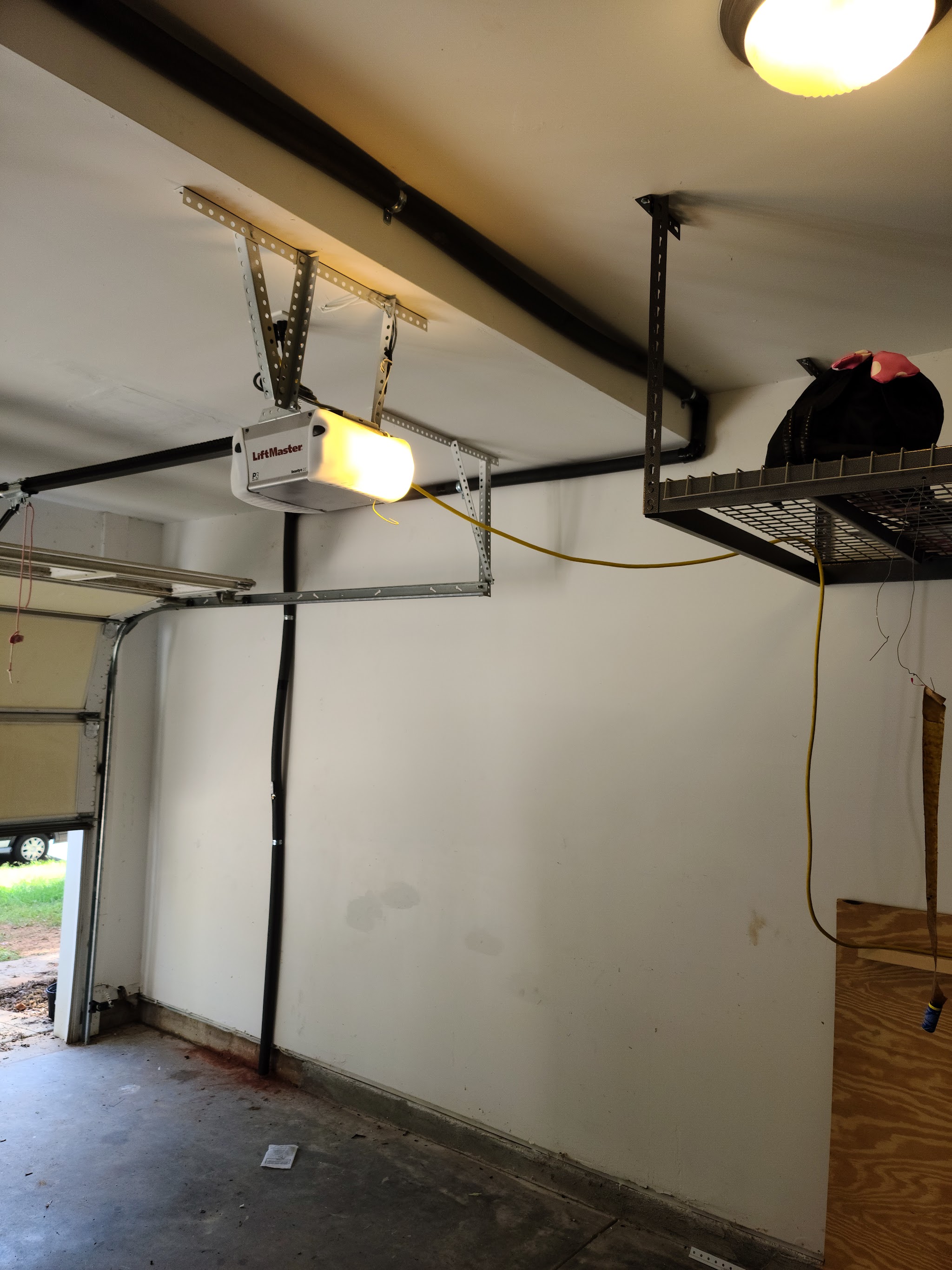 Garage ceiling with an opener and mounted rack