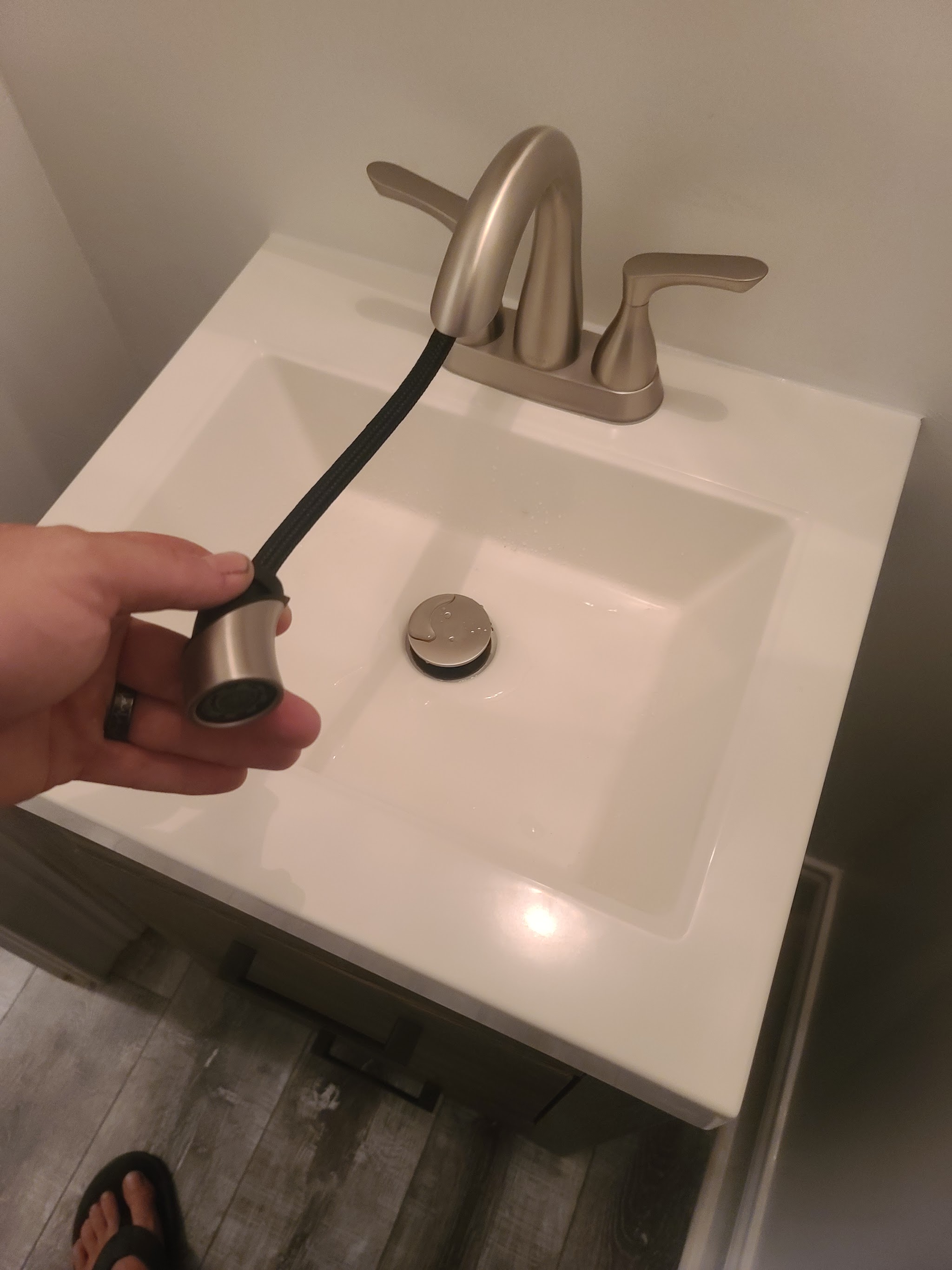 New bathroom sink with a brushed nickel faucet
